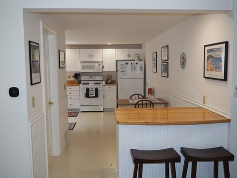 KITCHEN:  Looking into the kitchen from the living room.  The door to the common bathroom for the first floor is also at the left of the photo.