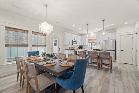 Dining table seats 8 with 3 more seats at the bar