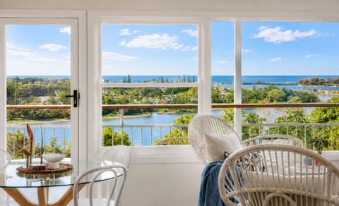 Wake to sparkling Shaws Bay views from your light-filled coastal retreat.