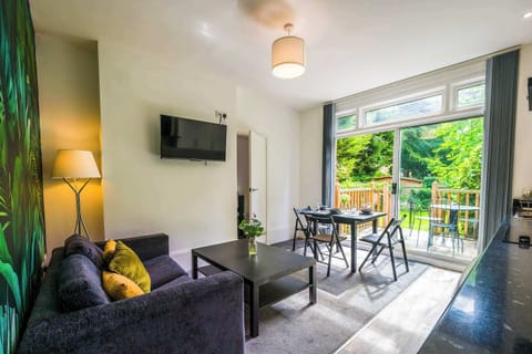 Open plan living with patio doors to a decking area