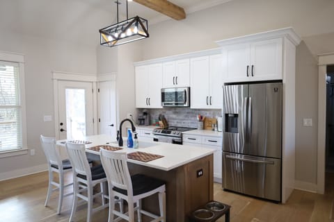 Full Kitchen. Sits 3 at the counter. Oven, stove, microwave and refrigerator.