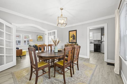 Your dining room is designed for comfort and style, featuring a spacious table perfect for family meals or game nights. Enjoy the cozy ambiance and all the amenities we offer to make your stay unforgettable. 🍽️✨