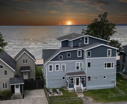 Picture perfect: With its pastel hues, gabled roofs, and white picket fences, this row of houses exudes a Norman Rockwell-esque charm, reminiscent of simpler times and sandy toes.