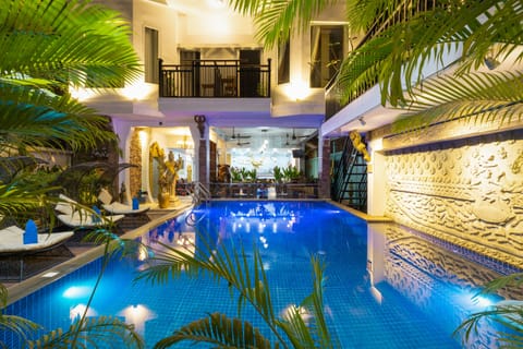 Outdoor pool, open 6:00 AM to 10:00 PM, sun loungers, lifeguards on site