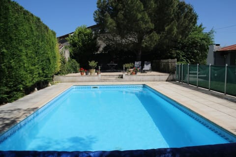 The fully enclosed pool with terrace above.