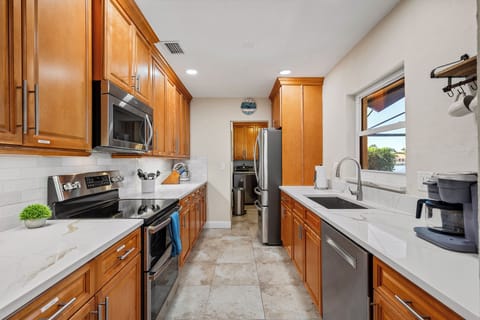 Full kitchen with Fridge , double oven microwave, dishwasher, grill essentials , cutlery