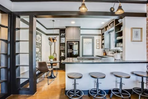 Open kitchen with bar seating and plenty of space to cook and hang out.
