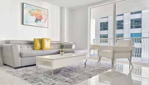 Living room features lush Italian sofa bed and 58" widescreen TV
