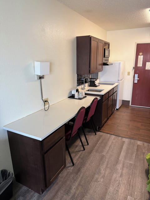 Room, 2 Double Beds, Kitchenette | Private kitchen | Full-size fridge, microwave, stovetop, coffee/tea maker