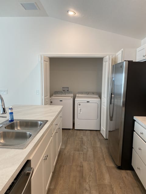 Brand new washer dryer in kitchen