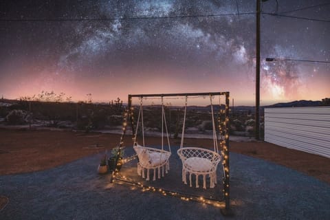 Swing into relaxation in our beautiful desert backyard, catching the sunset.