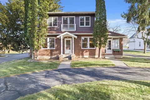 The front of the Home includes a horseshoe driveway leading up to the welcoming front entrance. The tall trees provide nice, cool shade and additional privacy.