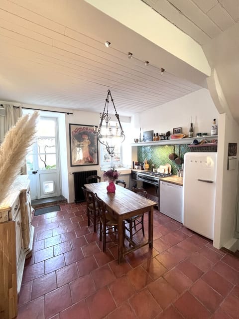 Fully equip kitchen with SMEG appliances, connected to cosy living room and private courtyard.