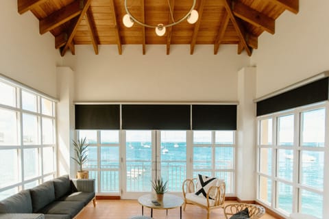 Luxury Studio Suite, 1 King Bed, Harbor View | Living area | 55-inch TV with cable channels
