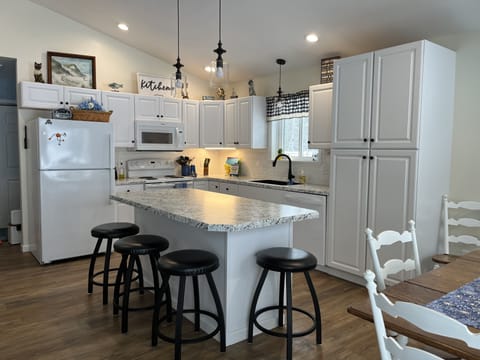 fully stocked kitchen, towels, hot pad, crock pot, blender etc