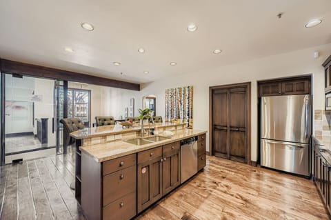 Your gourmet kitchen features granite countertops, stainless steel appliances, and an open design that flows seamlessly into the living area.