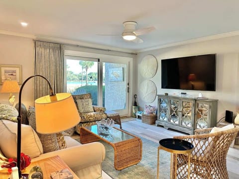 Relax in this coastal-inspired living room with water views and comfortable seating.