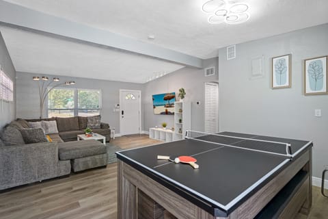 This dining table is more than just a surface for meals, it's a versatile piece of furniture that can provide endless hours of entertainment.