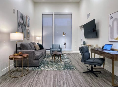 Living Room with comfy work Desk and 65" Roku 4K smart TV