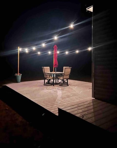 Unwind on the deck with string lights and fresh night air