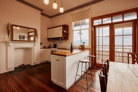 Friendly warm kitchen and dining area combines old fashion charm with modern appliances.