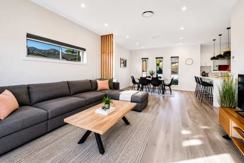 Relax in the spacious, light-filled lounge with comfortable seating, Smart TV and direct access to the outdoor area.