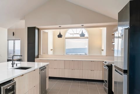 Bright kitchen with beautiful views of the lake while you cook.