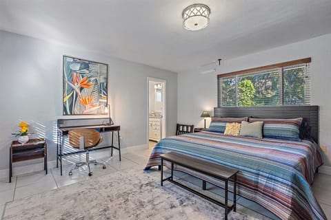 Spacious bedroom with King bed, high quality hotel linen and dedicated workspace