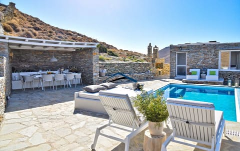 The pool area, villa and the dining area