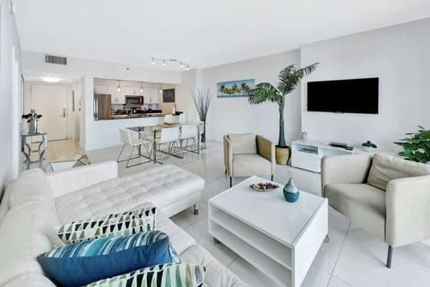 Bright and airy living room with stunning ocean views right from your private balcony.