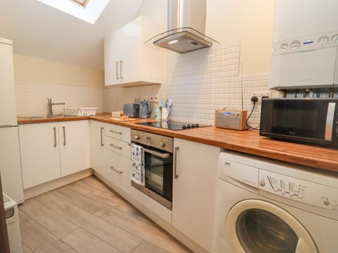 Fridge, electric kettle, toaster, cookware/dishes/utensils