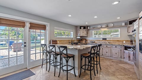 Modern Kitchen island breakfast bar with stools.