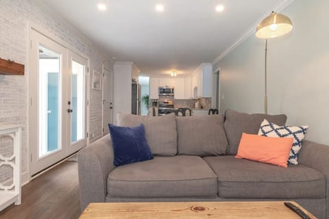 View from living room to kitchen with updated appliances.