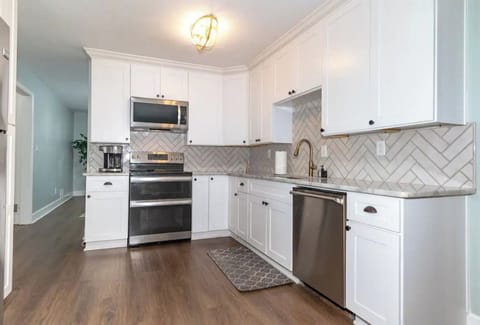 Double oven, microwave, dishwasher, fridge, air fryer, blender, toaster, coffee