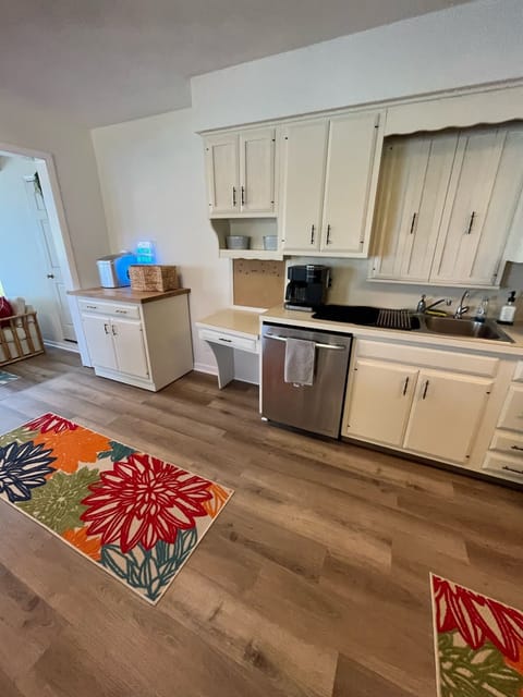 Stocked Keurig coffee maker, dish-washer and modern fridge.