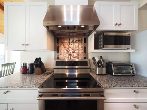 Induction range, double ovens, microwave, toaster oven, fully equipped kitchen