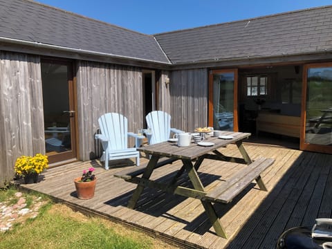 Spacious decking area, with spectacular views onto open farmland.