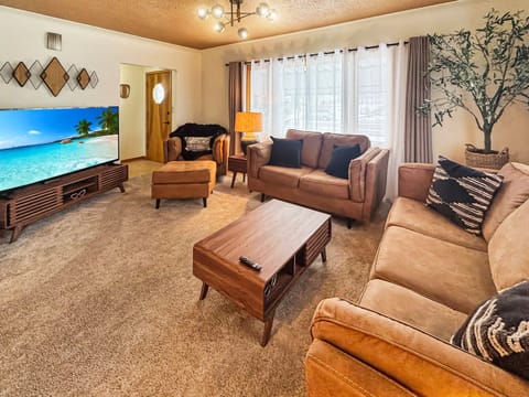 Cozy up on comfortable seating and enjoy the massive 75" screen