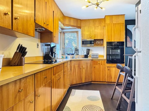 Fully equipped kitchen with modern appliances and everything you need for home-cooked meals