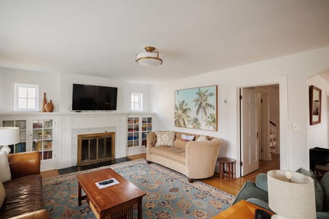 Bright and Sunny Living Room with 2 couches and 2 love seats. Smart TV and plenty of games for all!