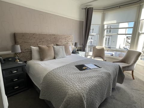 Deluxe Room, 1 King Bed, Partial Sea View | Iron/ironing board, free WiFi, bed sheets