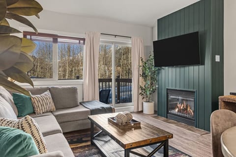 Surrounded by nature with soft forest green hues throughout make the unit feel warm and inviting