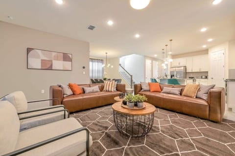 Living room with plenty of sofa seating for the whole group.