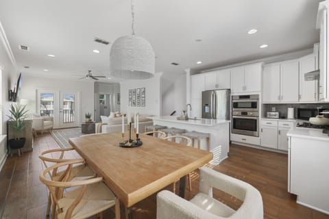 Second-floor open concept living, dining, and kitchen area.  A bright gathering space perfect for relaxing with your group.
