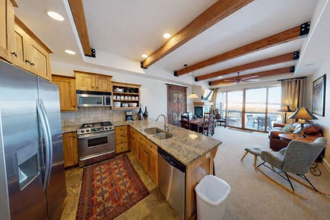 Relax in this mountain-modern open-concept retreat. Featuring a fully equipped kitchen with granite countertops, warm wood accents, and a cozy stone fireplace for the ultimate Park City escape.