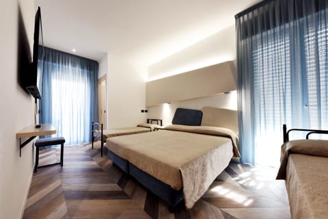 Superior Quadruple Room | Minibar, in-room safe, individually furnished, desk