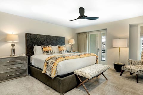 Primary Bedroom with King Bed, Ceiling Fan and TV with cable.