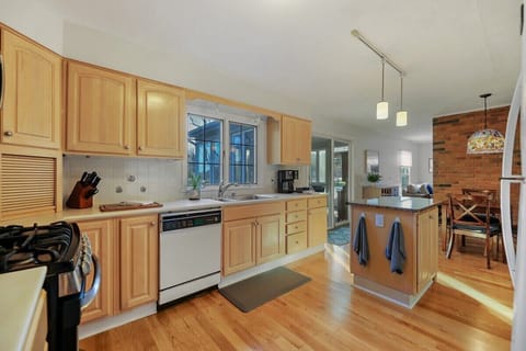 Kitchen view shows the Breakfast Nook and the Sliding Doors to the Sun Room
