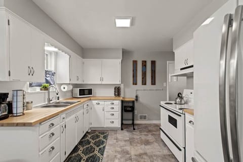 Step into our bright and fully stocked kitchen. With all the essentials at your fingertips, cooking is a breeze.