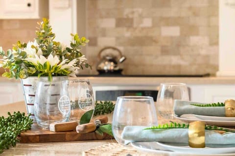 A glass of wine ready to be enjoyed on a perfectly set dining area.